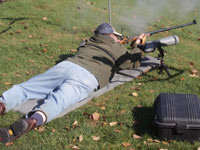 Man shooting black powder rifle